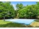 Full sized outdoor basketball court and a shaded bench for watching the game at 138 Grand Ave, Suwanee, GA 30024