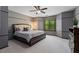 Spacious bedroom with a large window offering natural light and a beautiful outdoor view at 138 Grand Ave, Suwanee, GA 30024