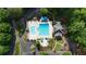 Aerial view of a community pool featuring a large pool with an additional pool and lounge area at 138 Grand Ave, Suwanee, GA 30024