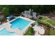 Community pool with a spacious deck, lounge chairs, and manicured landscaping, ideal for relaxation and social gatherings at 138 Grand Ave, Suwanee, GA 30024