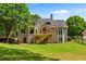 Back of house featuring a wooden deck, and landscaped yard at 138 Grand Ave, Suwanee, GA 30024