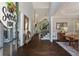 Inviting foyer with soaring ceilings, hardwood floors, and elegant staircase at 138 Grand Ave, Suwanee, GA 30024