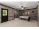 Basement game room with a pool table, art, and a door to the exterior of the home at 138 Grand Ave, Suwanee, GA 30024