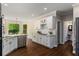 Bright kitchen with marble countertops, stainless steel appliances, and white cabinets at 138 Grand Ave, Suwanee, GA 30024