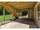 Covered patio with stairs to the backyard and a grassy area at 138 Grand Ave, Suwanee, GA 30024