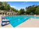 Community pool features lap lanes and plenty of room for swimming with lots of lounge chairs at 138 Grand Ave, Suwanee, GA 30024