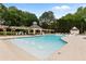 Resort style zero entry pool with fountains, shade pergola, and plenty of lounge chairs at 138 Grand Ave, Suwanee, GA 30024