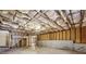 Unfinished basement with exposed ceiling and concrete floor, offering potential for customization and expansion at 4940 Hanna Kate Ct, Cumming, GA 30028