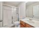 Clean bathroom featuring a shower with glass doors, toilet, and a vanity with ample counter space at 4940 Hanna Kate Ct, Cumming, GA 30028