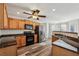 Functional kitchen boasts stainless steel appliances, granite countertops, and warm wooden cabinetry at 4940 Hanna Kate Ct, Cumming, GA 30028