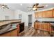 Kitchen with wood cabinets, granite countertops and stainless steel sink at 4940 Hanna Kate Ct, Cumming, GA 30028