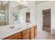 Light-filled Primary bathroom with dual sinks, walk-in shower, and ample cabinet space at 4940 Hanna Kate Ct, Cumming, GA 30028