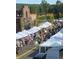 Lively street scene with tents and vendors for a community outdoor market at 4940 Hanna Kate Ct, Cumming, GA 30028