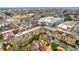 Expansive aerial view of multi-unit housing complex surrounded by trees and city landscape at 625 Piedmont Ne Ave # 2004, Atlanta, GA 30308