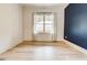 Bedroom with an accent wall and a large window with lots of natural light at 625 Piedmont Ne Ave # 2004, Atlanta, GA 30308