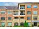 Exterior view of multi-story building with balconies and stonework facade at 625 Piedmont Ne Ave # 2004, Atlanta, GA 30308