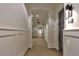 Well-lit hallway with neutral walls and tiled floor, showcasing apartment unit doors at 625 Piedmont Ne Ave # 2004, Atlanta, GA 30308