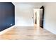 Hallway featuring hardwood floors, leading to an open layout at 625 Piedmont Ne Ave # 2004, Atlanta, GA 30308