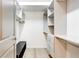 Bright walk-in closet with custom shelving and storage compartments at 625 Piedmont Ne Ave # 2004, Atlanta, GA 30308