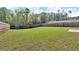 Large backyard with grass and wood fence at 6920 Oak Valley Dr, Douglasville, GA 30134