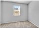 Neutral bedroom featuring plush carpet, a window and light gray walls at 6920 Oak Valley Dr, Douglasville, GA 30134