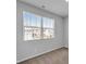 Bright bedroom featuring neutral carpet, and a large window for natural light at 6920 Oak Valley Dr, Douglasville, GA 30134