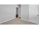 Neutrally painted bedroom featuring plush carpet, and a paneled closet door at 6920 Oak Valley Dr, Douglasville, GA 30134