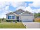 Charming single-Gathering home featuring a two-car garage, and a well-manicured front yard at 6920 Oak Valley Dr, Douglasville, GA 30134