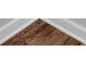 Close up of wood flooring with white trim at 6920 Oak Valley Dr, Douglasville, GA 30134