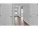 Hallway featuring laminate flooring and a view of the front door with a wreath at 6920 Oak Valley Dr, Douglasville, GA 30134