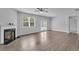 Living room featuring fireplace, hardwood floors and ceiling fan at 6920 Oak Valley Dr, Douglasville, GA 30134