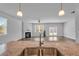 Open-concept living room featuring a fireplace, ceiling fan, and an island with a sink at 6920 Oak Valley Dr, Douglasville, GA 30134