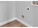 Utility area featuring laminate flooring and hookups ready for washer and dryer at 6920 Oak Valley Dr, Douglasville, GA 30134