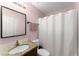 Bathroom with granite vanity, frameless mirror, and shower and tub combination at 753 Brookwood Sw Ter, Lilburn, GA 30047