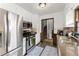 Updated kitchen features stainless steel appliances and convenient access to stairs at 753 Brookwood Sw Ter, Lilburn, GA 30047