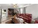 Living room with a fireplace, hardwood floors, and comfortable leather seating at 753 Brookwood Sw Ter, Lilburn, GA 30047