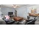 Comfortable living room featuring wood flooring and a ceiling fan at 753 Brookwood Sw Ter, Lilburn, GA 30047