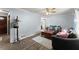 Comfortable living room featuring wood flooring and a ceiling fan at 753 Brookwood Sw Ter, Lilburn, GA 30047