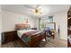Bedroom boasts wood furniture and ample natural light at 753 Brookwood Sw Ter, Lilburn, GA 30047