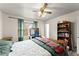Bedroom boasts wood furniture and ample natural light at 753 Brookwood Sw Ter, Lilburn, GA 30047