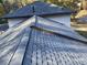 High angle shot of roof with gray shingles and dark brown trim on two story home at 753 Brookwood Sw Ter, Lilburn, GA 30047