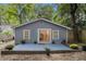 Backyard featuring a patio and the home's exterior with light blue siding and white trim at 1812 Defoor Nw Ave, Atlanta, GA 30318