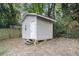 Detached shed exterior featuring simple siding and access steps in a foliage-filled backyard at 1812 Defoor Nw Ave, Atlanta, GA 30318