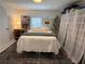 Bedroom featuring a large window, decorative accents, and cozy furnishings at 1812 Defoor Nw Ave, Atlanta, GA 30318