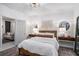 Cozy bedroom with natural light, stylish furnishings, and a view into the living space at 1812 Defoor Nw Ave, Atlanta, GA 30318