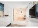 Bright bedroom featuring neutral walls, hardwood floors, and stylish decor with modern furnishings and a TV at 1812 Defoor Nw Ave, Atlanta, GA 30318