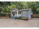 Attractive home with a welcoming porch, colorful landscaping, and concrete driveway at 1812 Defoor Nw Ave, Atlanta, GA 30318