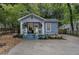 Charming blue home with a cozy front porch and beautifully landscaped front yard at 1812 Defoor Nw Ave, Atlanta, GA 30318