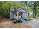 Quaint blue home with inviting front porch, lush landscaping, and well-maintained yard at 1812 Defoor Nw Ave, Atlanta, GA 30318