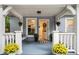 Charming front porch with decorative plants and a welcoming open door view at 1812 Defoor Nw Ave, Atlanta, GA 30318